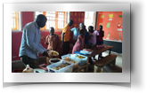 Joseph Serwada feeds the children.jpg